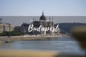 Das Parlamentsgebäude in Budapest mit der Aufschrift "Glutenfrei durch Budapest - Restaurants & Supermärkte"
